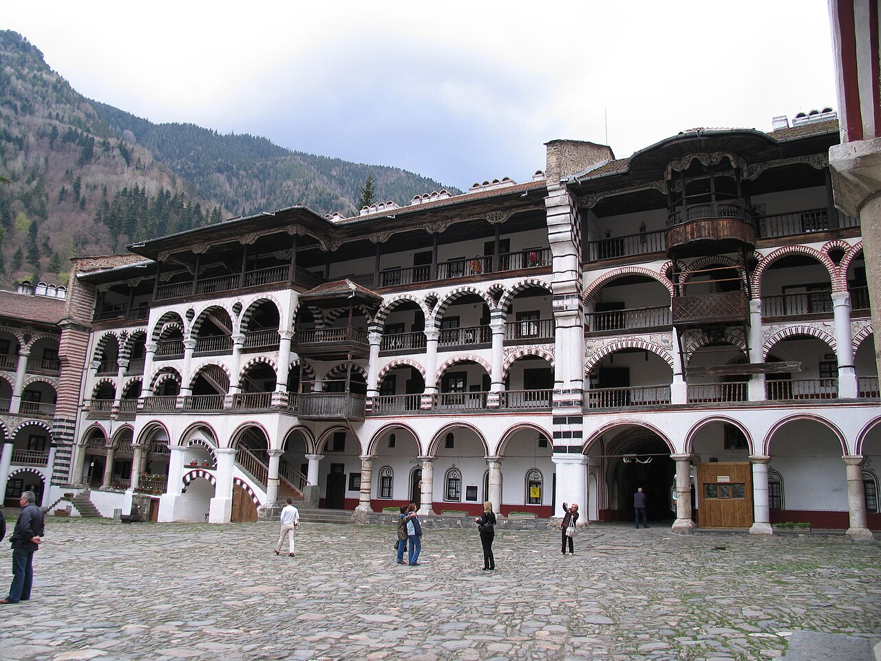 Courtyard, church and arcaded buildings at Rila Monastery in Bulgaria