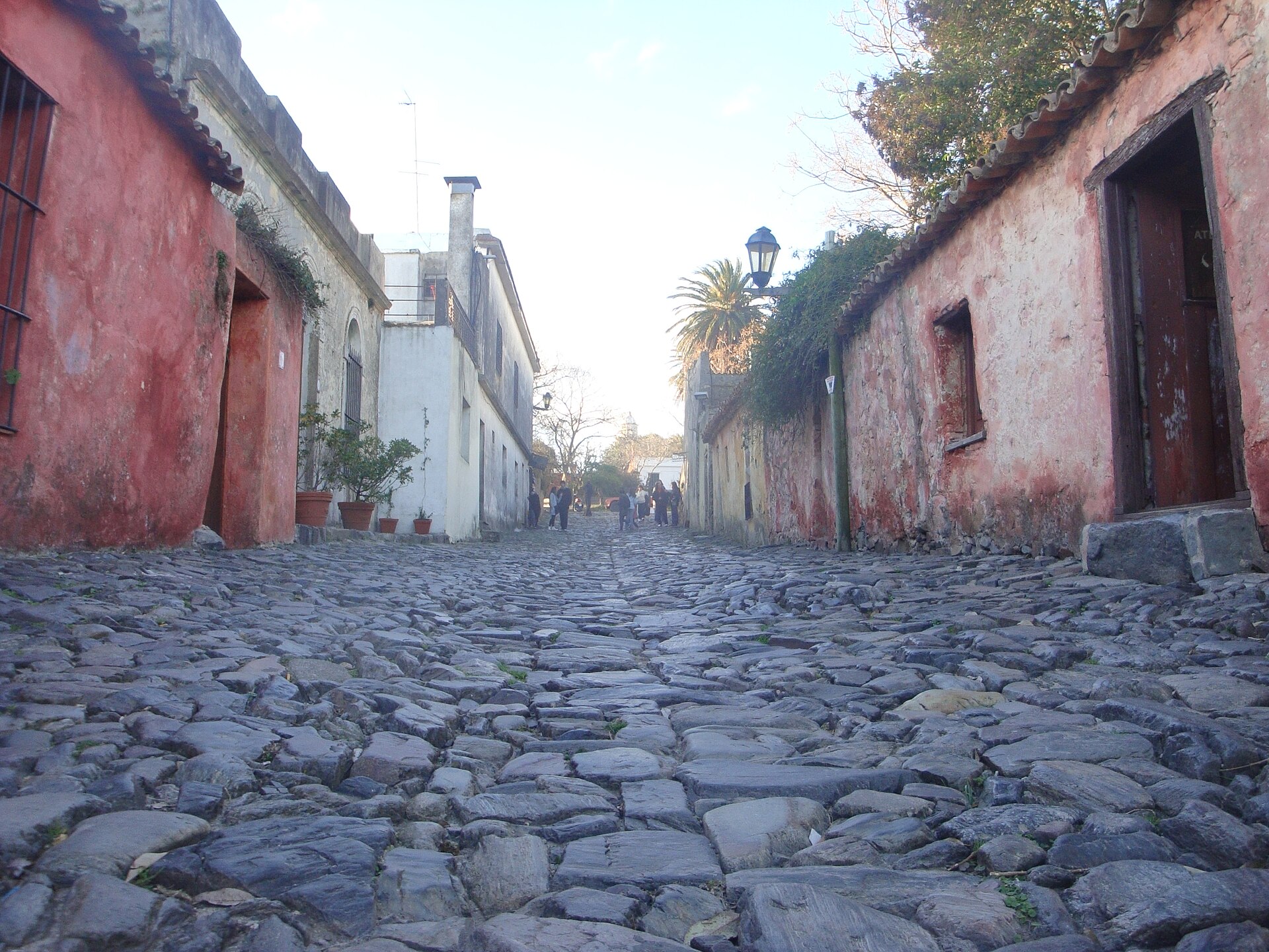 Uneven cobblestones between low historic houses on Calle de los Suspiros in Colonia del Sacramento