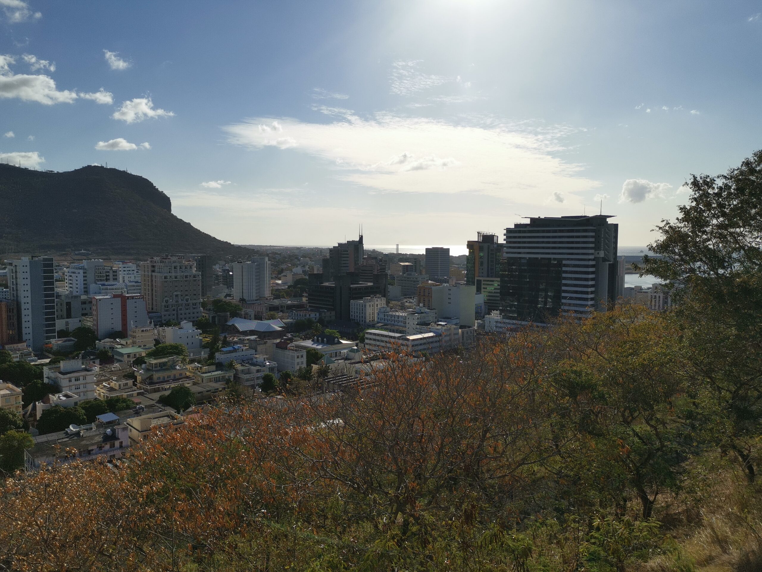 Port Louis buildings and hills seen from Fort Adelaide, with the harbour beyond.